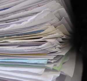A stack of papers is shown with the paper folded over.