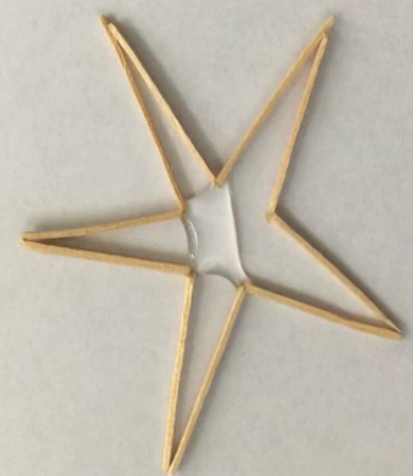 A star made out of toothpicks and glue.